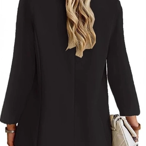 Back view of a sleek black slim-fit blazer with professional center seam tailoring