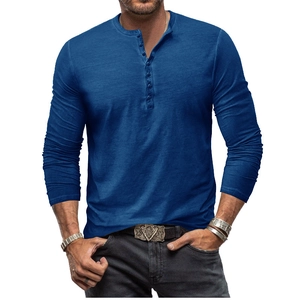 Detail of navy blue tie-dye Henley shirt showing buttoned V-neck and textured fabric