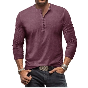 Close-up of vintage tie-dye Henley shirt featuring a multi-button neckline and textured fabric
