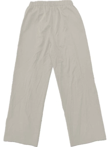 Detail of high-waist loose trousers showing elastic waistband and linen texture