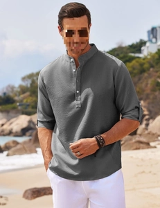 Detailed view of grey textured waffle fabric on a men's stand collar casual beach shirt