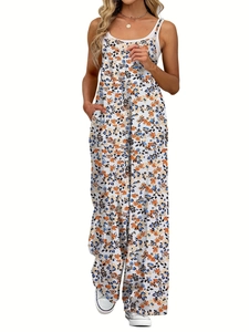 Detailansicht eines gelben Blumen-Jumpsuits mit verstellbaren Trägern und praktischen Taschen