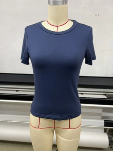 Detail of slim fit navy blue crew neck T-shirt fabric texture and neckline stitching