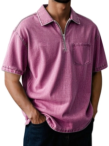 Detail view of purple men's polo shirt featuring half-zip collar and chest pocket texture