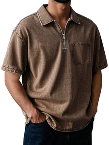 Detail of men's cotton polo shirt showing zip collar and washed vintage texture