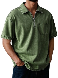 Detail of army green cotton polo shirt with zipper placket and chest pocket texture