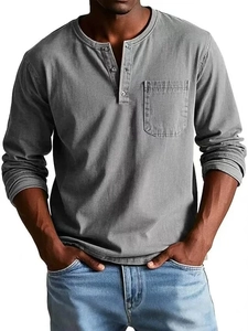 Detailed view of the three-button Henley neckline and chest pocket on a grey shirt