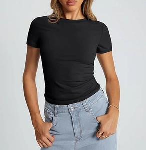 Detail of slim fit black crew neck t-shirt paired with high waist light blue denim jeans