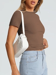 Close-up of slim-fit brown crew neck T-shirt fabric and clean tailoring for women