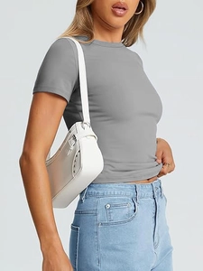 Detail of grey slim fit crew neck short sleeve tee with blue jeans and white bag