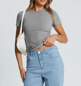 Close-up of slim fit grey crew neck T-shirt paired with light blue jeans and accessories