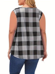Detail showing the curved hem and black buffalo plaid pattern on a loose fit tank top