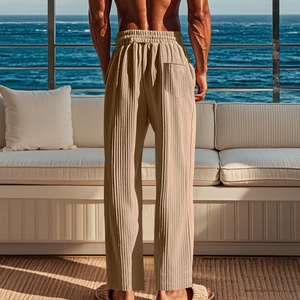 Detail of light apricot vertical pleated men's trousers with drawstring waist and pocket