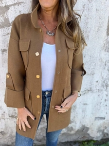 Detail of a brown double-faced wool jacket with vintage buttons and utility pockets