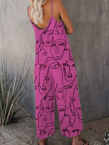 Detail eines fuchsiaweiten Jumpsuits mit einzigartigen schwarzen Linien-Gesichtsmustern und Stoff