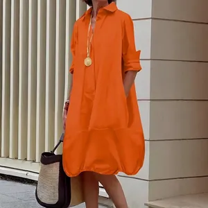Women's bright orange button-down midi shirt dress with lantern hem and loose fit cut