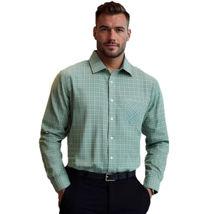 Detail of sage green plaid shirt showing button-down collar and chest pocket