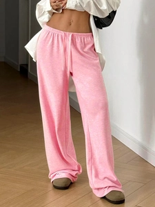 Detail of pink lightweight straight leg joggers featuring an elastic drawstring waist design