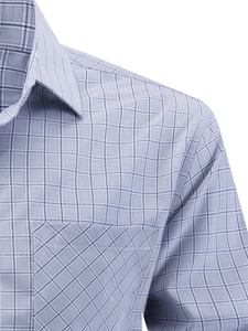 Detail of blue-grey plaid men's shirt showing the chest pocket with diagonal pattern texture