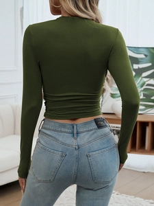 Rear view of dark green slim fit long sleeve top with side ruched waist details