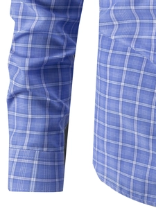 Detailed view of the blue and white checkered shirt cuff and stitched side hem fabric