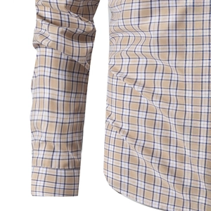 Close-up of long sleeve plaid business shirt with classic khaki and navy check pattern