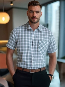 Detail view of business casual short sleeve plaid shirt with single chest pocket and buttons