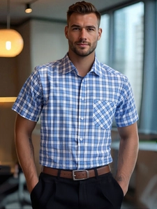 Detailed close-up of blue and white plaid short-sleeved business casual men's shirt