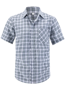 Detail view of men's short-sleeved plaid shirt featuring a chest pocket and buttons