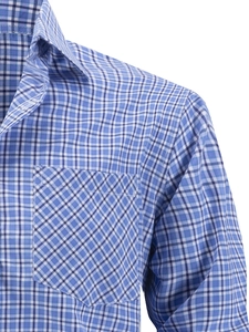Detailed close-up of blue and white plaid shirt showing the collar and chest pocket
