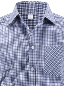 Detail of blue plaid business shirt showing fine cotton texture and chest pocket