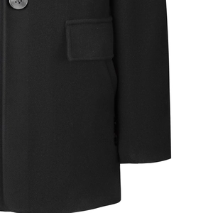 Close-up of black wool coat pocket with flap and neat stitching on warm winter overcoat