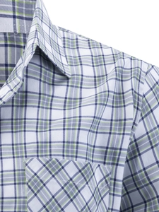 Detailed view of the blue and green plaid pattern on the business casual shirt's pocket
