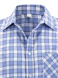 Detail shot of men's blue plaid shirt showing buttoned collar and chest pocket texture