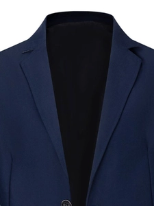 Detail view of navy blue business blazer lapel with textured fabric and dark button