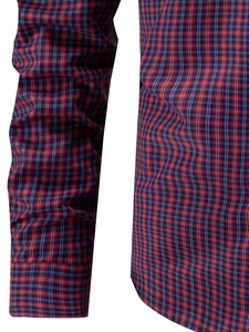 Detail of red and blue plaid shirt sleeve showing fine cotton fabric texture
