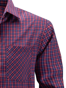 Detail of red and blue plaid shirt featuring a 45-degree diagonal chest pocket design