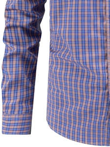 Detail of blue and orange plaid shirt showing precise stitching and fabric texture