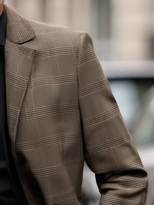 Detailed macro view of Glen check pattern on men's business casual blazer suit