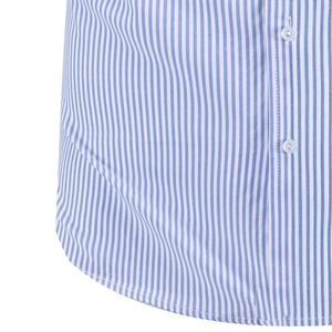 Detail of blue and white vertical stripes, white resin buttons, and curved hem on shirt
