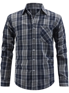 Close-up of blue and grey plaid men's long sleeve shirt with classic collar and pocket