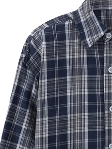 Close-up of blue and white plaid pattern on a men's long-sleeved button-down shirt