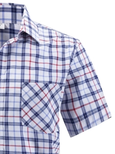 Detailed close-up of a classic plaid shirt pocket with bias-cut patterns and soft cotton fabric