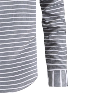 Detail of grey striped shirt sleeve showing contrast horizontal and vertical stitching