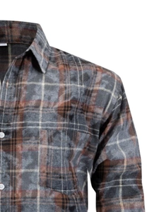 Detail of gray plaid flannel shirt featuring a pointed collar and textured fabric surface