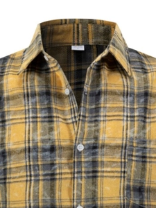 Close-up of black and yellow striped flannel shirt featuring pocket and US size L label