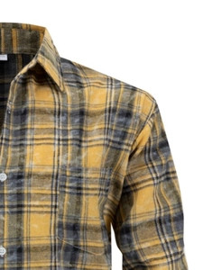 Close-up of yellow and grey flannel shirt showing texture, buttons and chest pocket