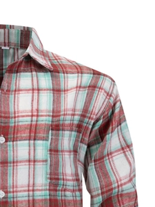 Detail of red and green plaid flannel shirt showing collar and chest pocket details