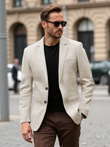 Detail of single-breasted beige casual blazer showing fine linen-blend fabric texture
