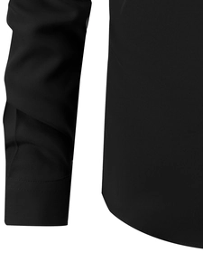 Detail shot of the precise stitching on the cuff and hem of a black long sleeve shirt
